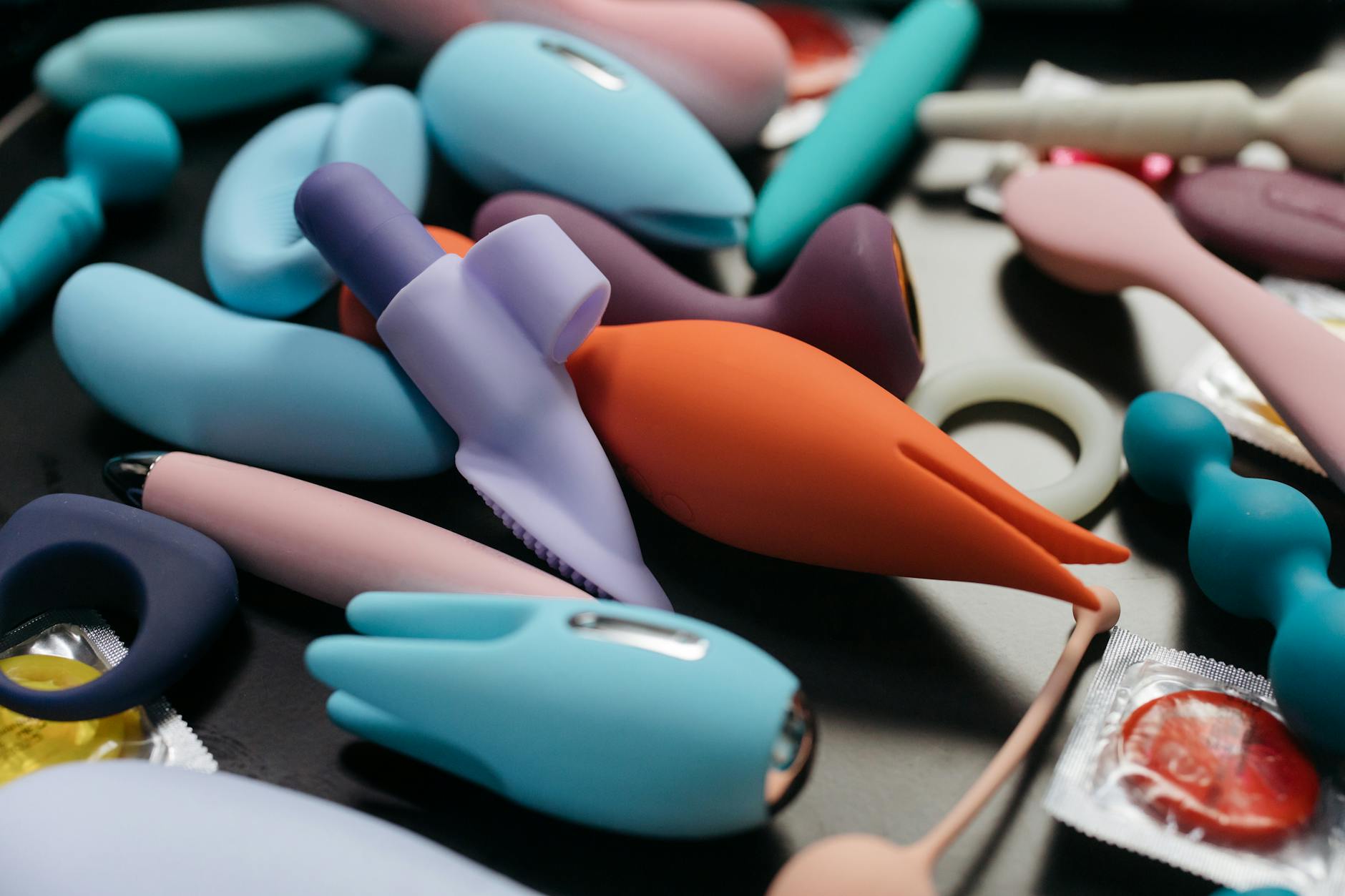 A couple standing together holding a vibrator, representing modern intimacy during life transitions.